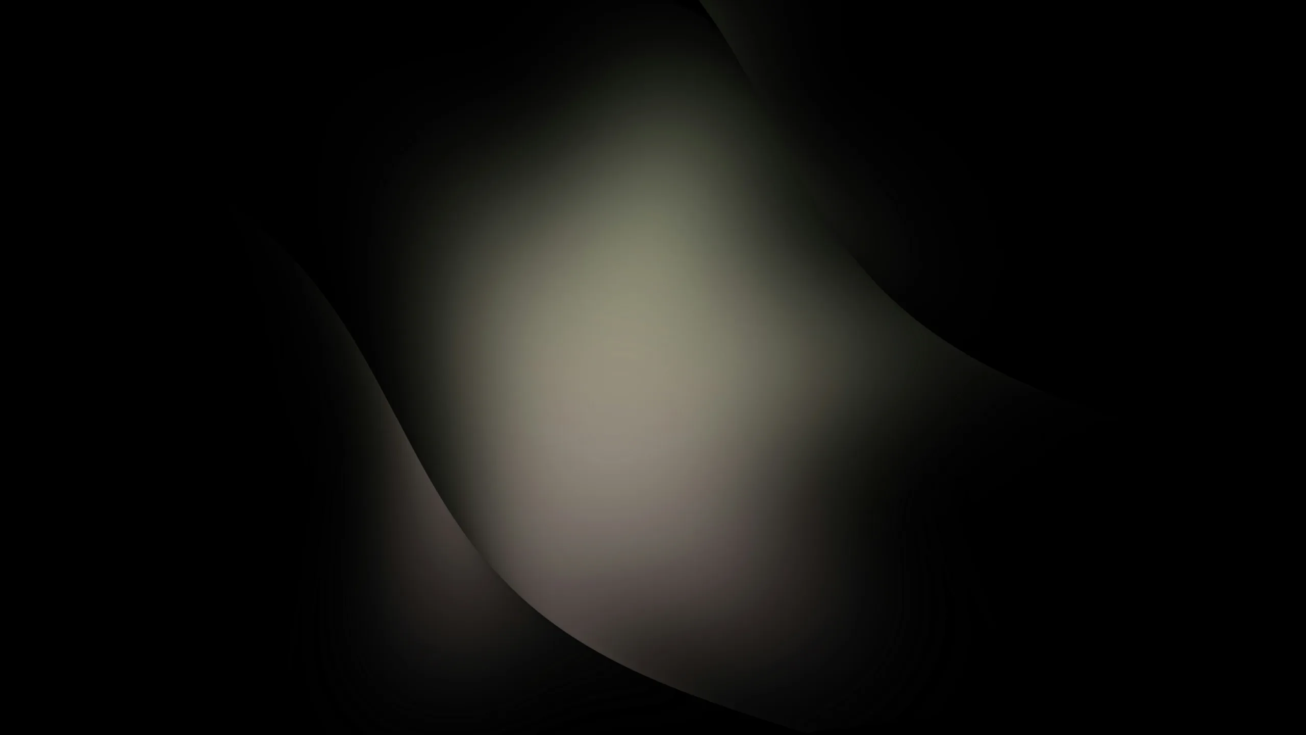 Fondo abstracto de luz difusa en tonos cálidos sobre negro